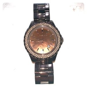 Chocolate metal fossil watch with crystal face.